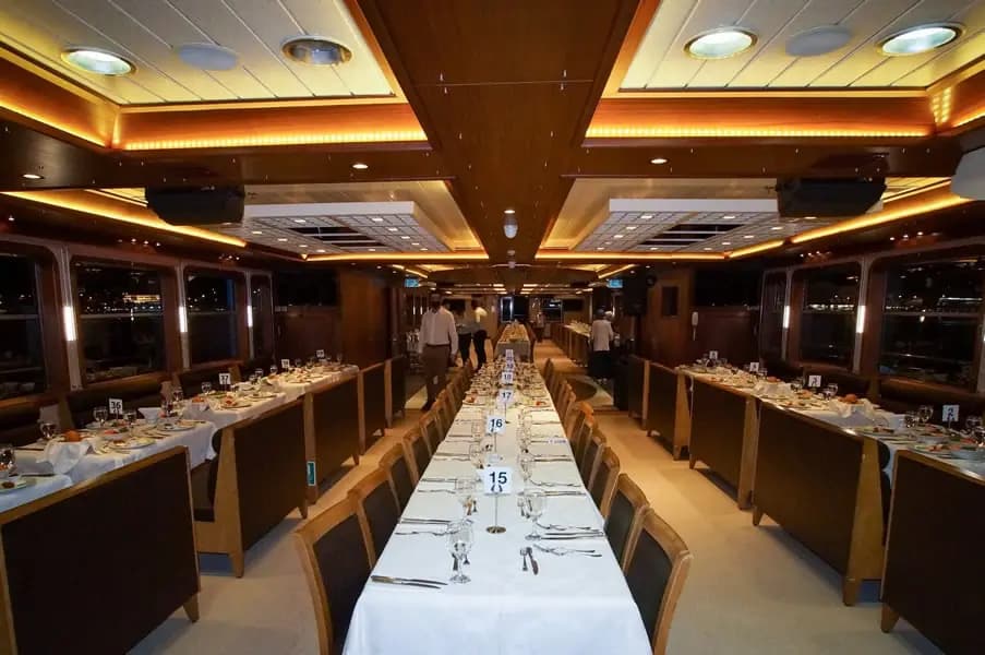 The BOSFOR's dining saloon seen from a second angle, tables set and ready for guests